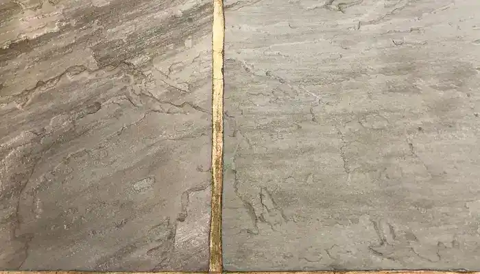 Close-up of riven slate showing raised texture, layers, and natural surface variation